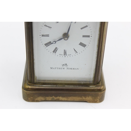 802 - A vintage Matthew Norman heavy brass cased  key wind carriage clock with eleven jewel movement