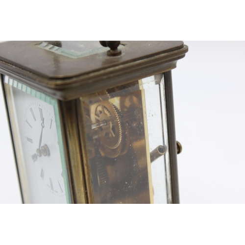 802 - A vintage Matthew Norman heavy brass cased  key wind carriage clock with eleven jewel movement