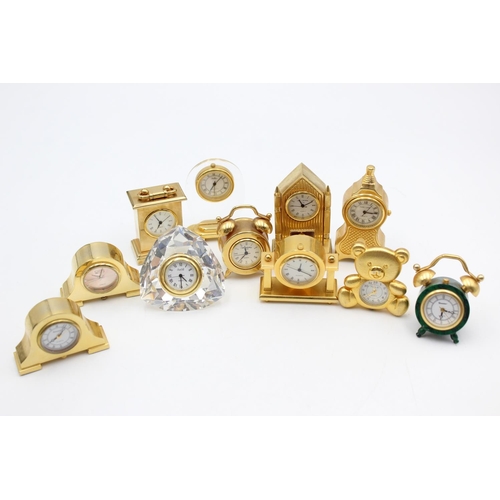 805 - Twelve assorted collectors/novelty miniature quartz clocks to include teddy bear, Cathedral etc.