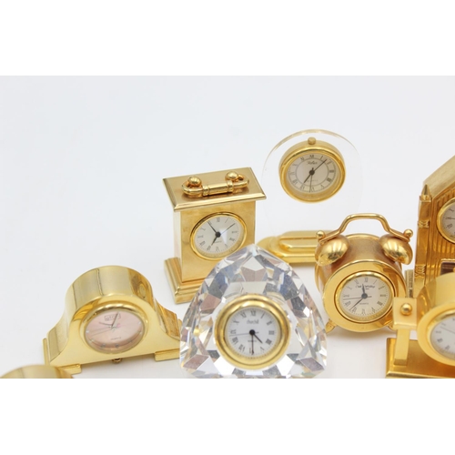 805 - Twelve assorted collectors/novelty miniature quartz clocks to include teddy bear, Cathedral etc.