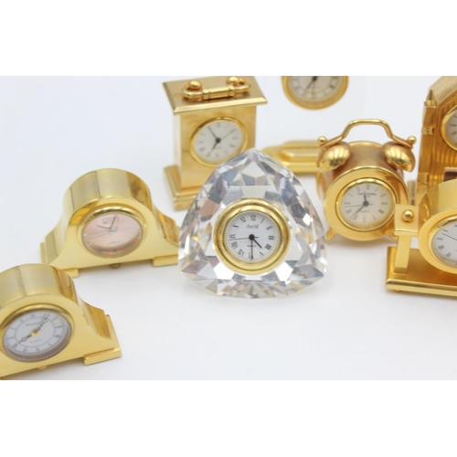 805 - Twelve assorted collectors/novelty miniature quartz clocks to include teddy bear, Cathedral etc.