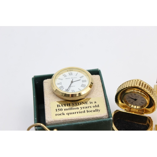 806 - Twelve assorted collectors/novelty miniature quartz clocks to include heart trinket box, Humming Bir... 