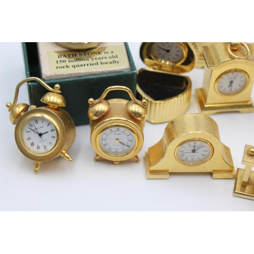 806 - Twelve assorted collectors/novelty miniature quartz clocks to include heart trinket box, Humming Bir... 