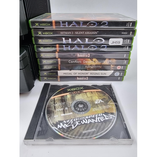 1500 - Two Xbox Original consoles and games to include Halo, Halo 2, Hitman, Medal of Honour, Call of Duty ... 