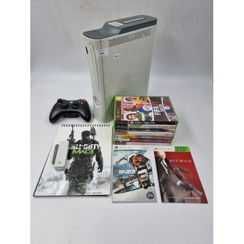 1499 - An Xbox 360 console with controller and games to include Hitman, The Simpsons Hit & Run, Crackdown e... 