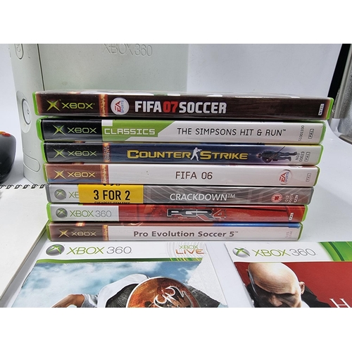 1499 - An Xbox 360 console with controller and games to include Hitman, The Simpsons Hit & Run, Crackdown e... 