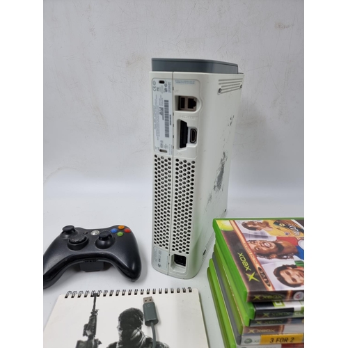 1499 - An Xbox 360 console with controller and games to include Hitman, The Simpsons Hit & Run, Crackdown e... 