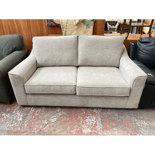 1154 - A modern light grey upholstered two seater sofa with Union Jack label to reverse - approx. 88cm high... 