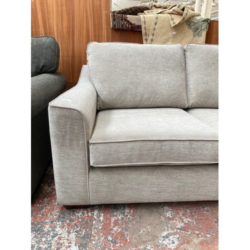 1154 - A modern light grey upholstered two seater sofa with Union Jack label to reverse - approx. 88cm high... 