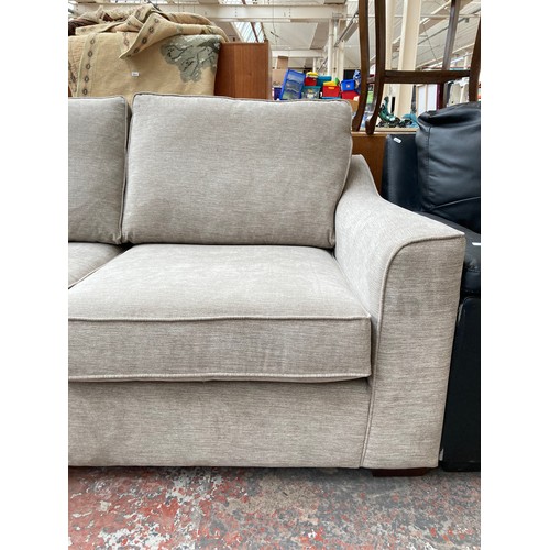 1154 - A modern light grey upholstered two seater sofa with Union Jack label to reverse - approx. 88cm high... 