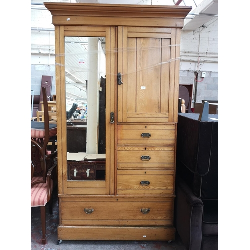 1099 - An early 20th century oak wardrobe - approx. 211cm high x 118cm wide x 53cm deep