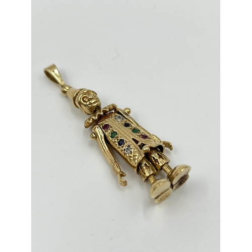 2325 - A 9ct gold articulated clown pendant with inset diamonds, emeralds, sapphires and rubies - approx. g... 