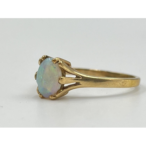 2323 - A 9ct gold opal solitaire ring, size R - approx. gross weight 2.05 grams