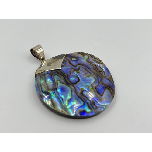 2328 - Two 925 silver abalone shell and plastic pendants - approx. gross weight 15.3 grams