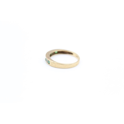 2352 - A 9ct gold emerald and diamond half eternity ring, size L - approx. gross weight 1.8 grams