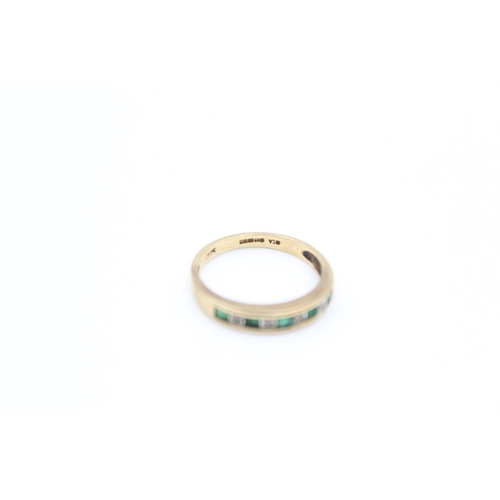 2352 - A 9ct gold emerald and diamond half eternity ring, size L - approx. gross weight 1.8 grams