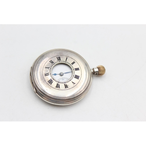 2434 - A vintage Longines .925 silver cased hand wind half hunter pocket watch