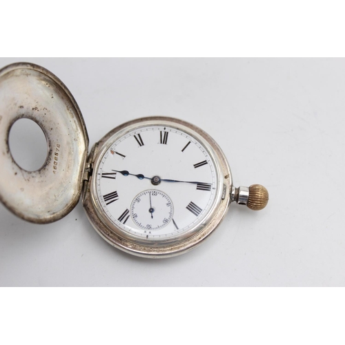 2434 - A vintage Longines .925 silver cased hand wind half hunter pocket watch