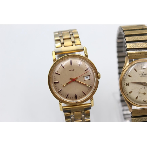 2438 - Three vintage gold tone hand wind men's wristwatches to include Rotary, Avia etc.