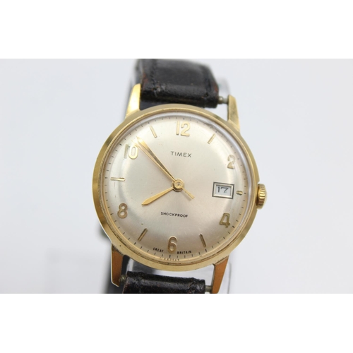 2464 - Three vintage gold tone hand wind men's wristwatches to include Fleurier, Timex etc.