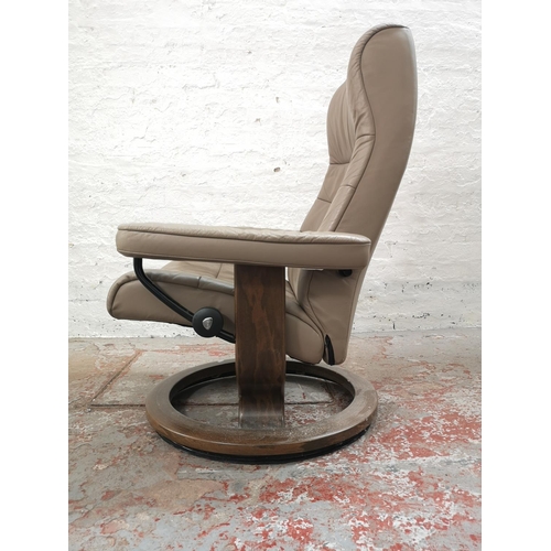 1072B - An Ekornes Stressless light brown leather armchair with stool - approx. 98cm high x 75cm wide x 62cm... 