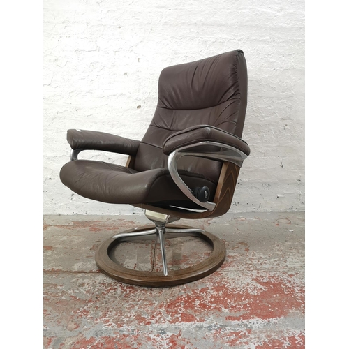 1072C - An Ekornes Stressless brown leather armchair - approx. 102cm high x 85cm wide x 62cm deep