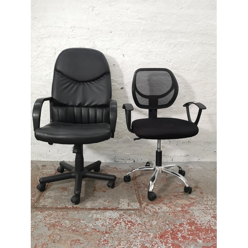 1072F - Two modern black office swivel desk chairs