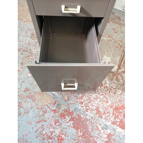 1073E - A Stor grey metal four drawer office filing cabinet - approx. 72cm high x 34cm wide x 49cm deep