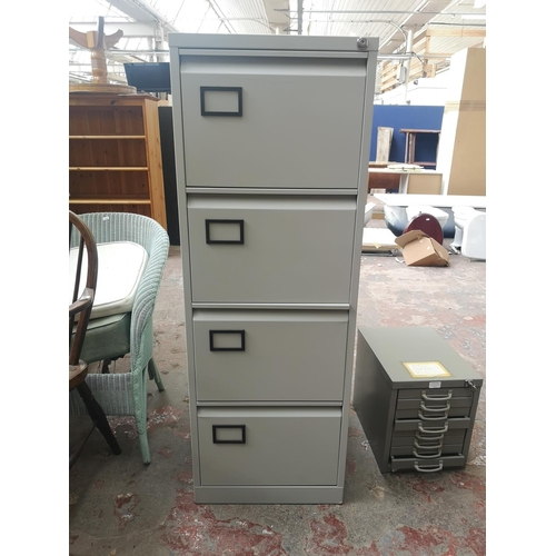 1117F - A grey metal four drawer office filing cabinet - approx. 132cm high x 47cm wide x 62cm deep