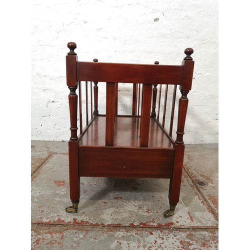 1141A - A 19th century style mahogany three division Canterbury magazine rack with brass casters and single ... 