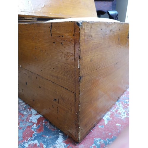 1147A - An early 20th century stained pine travel trunk with contents - approx. 42cm high x 72cm wide x 51cm... 