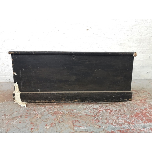 1156 - A Victorian black painted pine blanket box - approx. 48cm high x 114cm wide x 53cm deep