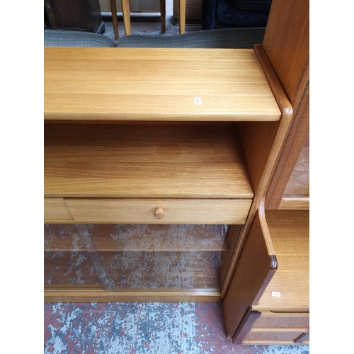 1159 - A Nathan teak bookcase with two drawers, two sliding glass doors and two internal shelves - approx. ... 