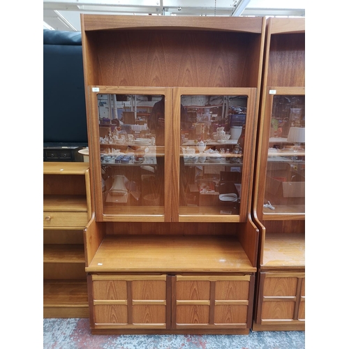 1160 - A Parker Knoll teak display cabinet with two upper glazed doors and two lower cupboard doors - appro... 