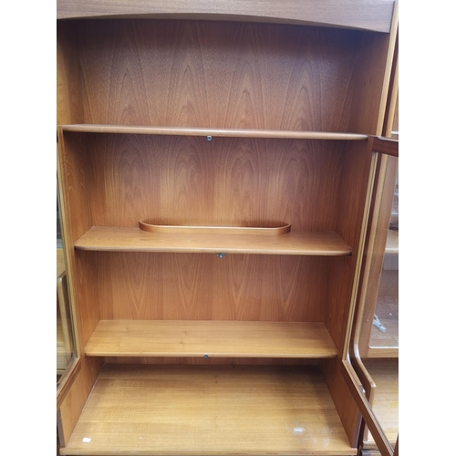 1160 - A Parker Knoll teak display cabinet with two upper glazed doors and two lower cupboard doors - appro... 