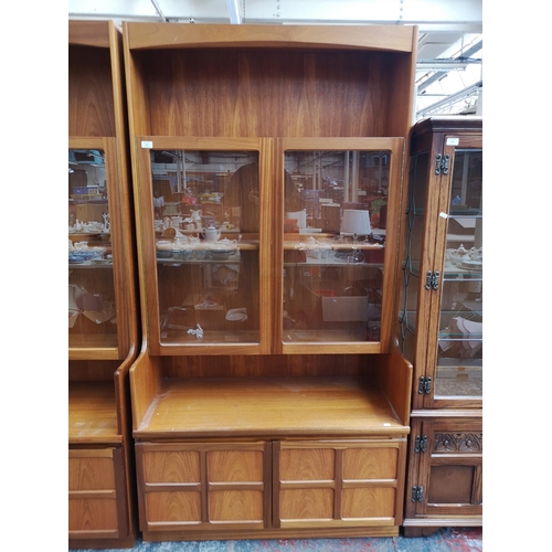 1161 - A Nathan teak display cabinet with two upper glazed doors and two lower cupboard doors - approx. 195... 