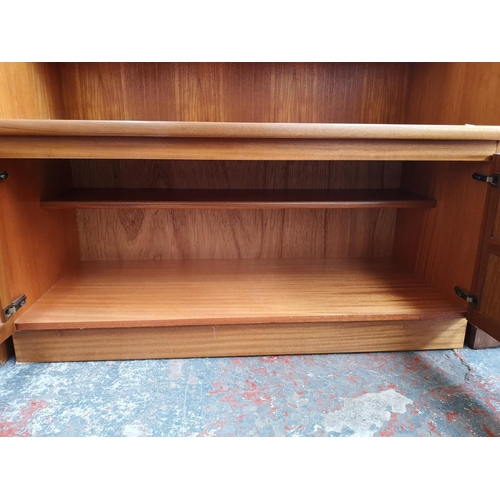 1161 - A Nathan teak display cabinet with two upper glazed doors and two lower cupboard doors - approx. 195... 