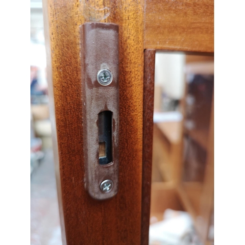 1161 - A Nathan teak display cabinet with two upper glazed doors and two lower cupboard doors - approx. 195... 