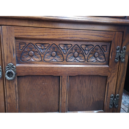 1162 - An Old Charm oak display cabinet with two upper leaded glass doors, two lower cupboard doors and thr... 