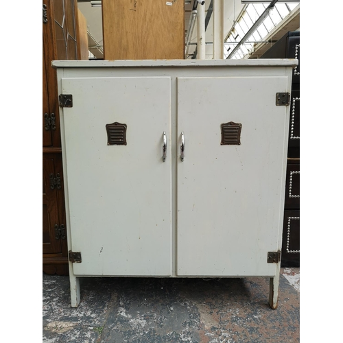 1163 - A mid 20th century grey painted wooden two door cabinet - approx. 84cm high x 76cm wide x 45cm deep