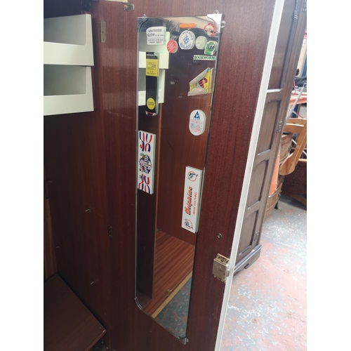 1166 - A Meredew oak and white painted three piece bedroom suite comprising wardrobe - approx. 154.5cm high... 