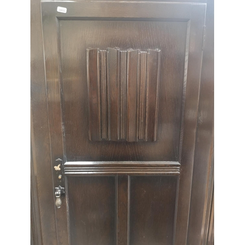 1172 - A mid 20th century oak linenfold single door wardrobe - approx. 186cm high x 79.5cm wide x 41cm deep