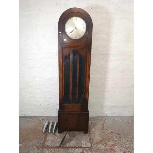 1176 - An Art Deco oak cased Grandfather clock with pendulum and three weights - approx. 196.5cm high x 48c... 