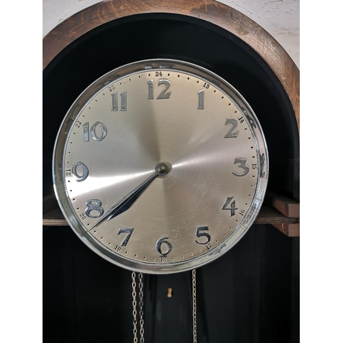 1176 - An Art Deco oak cased Grandfather clock with pendulum and three weights - approx. 196.5cm high x 48c... 