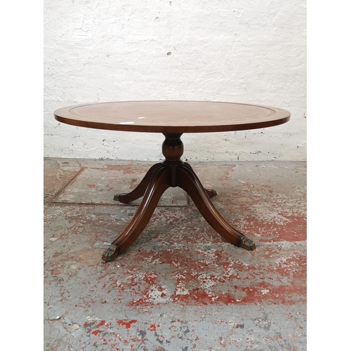 1179 - Two pieces of furniture, one Regency style mahogany circular coffee table with tan leather insert an... 