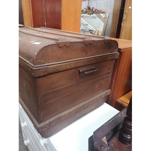 1119A - An early 20th century brown metal travel trunk with contents - approx. 48cm high x 78cm wide x 54cm ... 