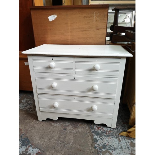 1119B - A white painted pine chest of two short over two long drawers - approx. 78cm high x 92cm wide x 48cm... 