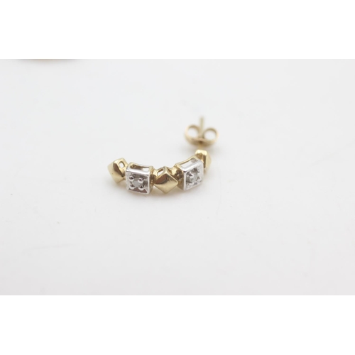 2158 - A pair of 9ct gold diamond half hoop earrings - approx. gross weight 1.1 grams