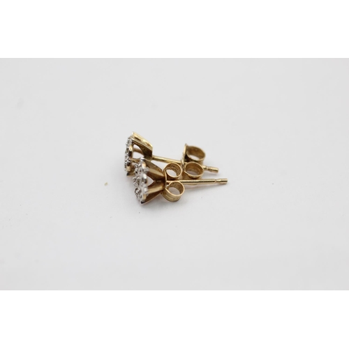 2160 - A pair of 9ct gold diamond stud earrings - approx. gross weight 0.8 grams