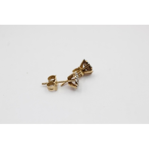 2160 - A pair of 9ct gold diamond stud earrings - approx. gross weight 0.8 grams